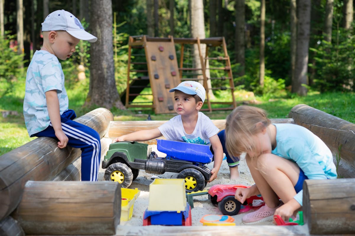 children playing with toy trucks