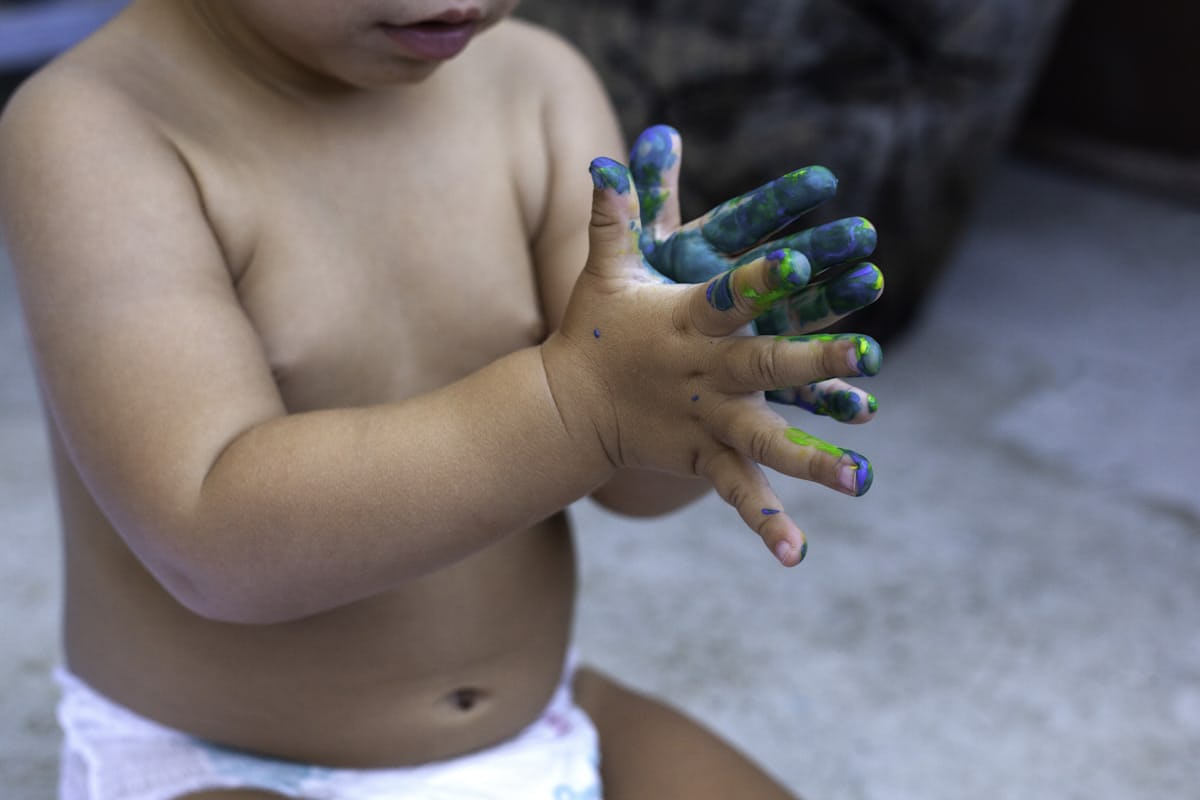 child with fingerpaint 